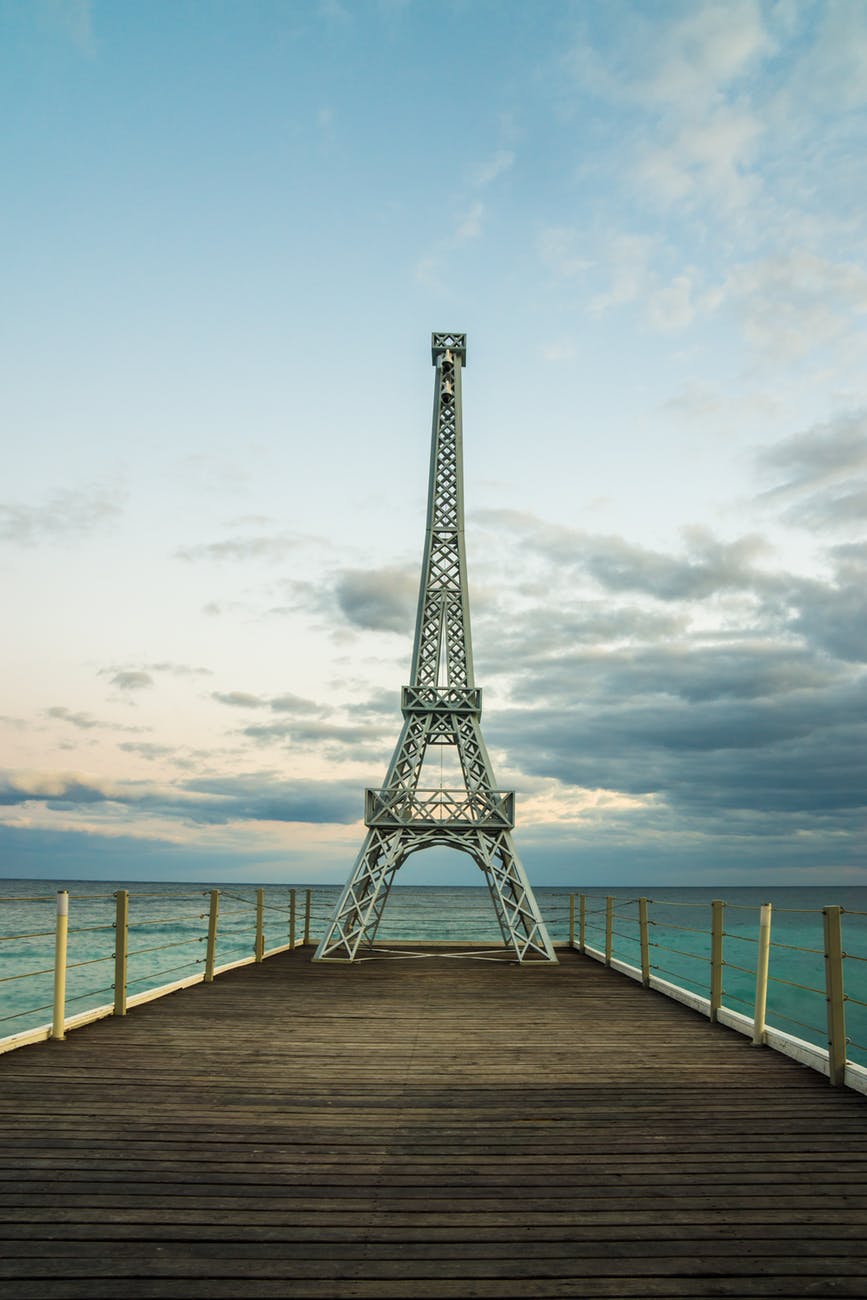 eiffel tower miniature on wooden docks
